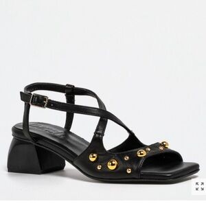 Black leather gold-studded low heel sandals